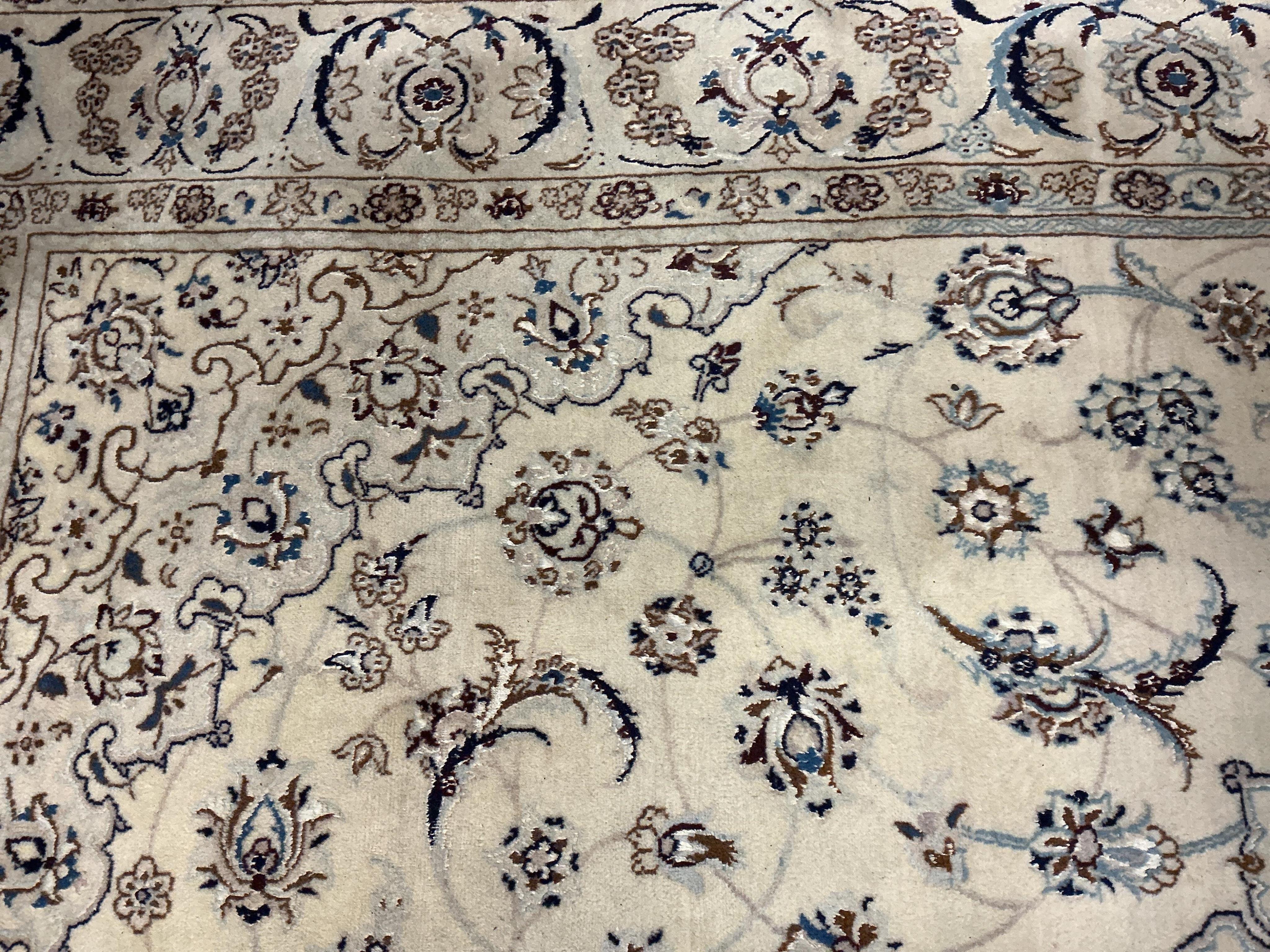 An ivory ground Nain carpet, 300cm x 206cm